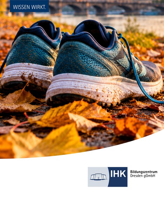 A pair of running shoes sits on a ground covered with autumn leaves. The background features a calm water scene, hinting at a peaceful environment. The image also includes text and a logo for an educational center in Dresden.